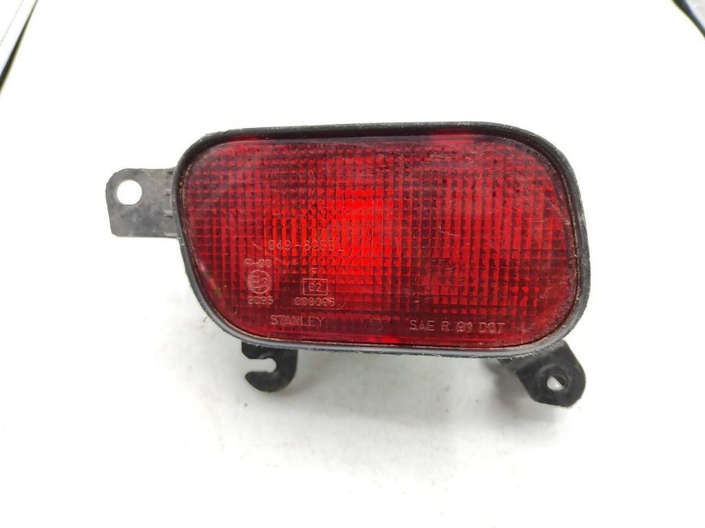 Mazda 323 1998 rear left side fog light 0498255L
